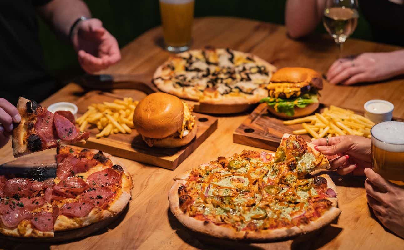 Enjoy Pub Food, Pizza, Burgers, Gluten Free Options, Dairy Free Options, Vegetarian options, Bars & Pubs, $$, Bar Scene and Groups cuisine at Rhino's Ski Shack in Queenstown CBD, Queenstown